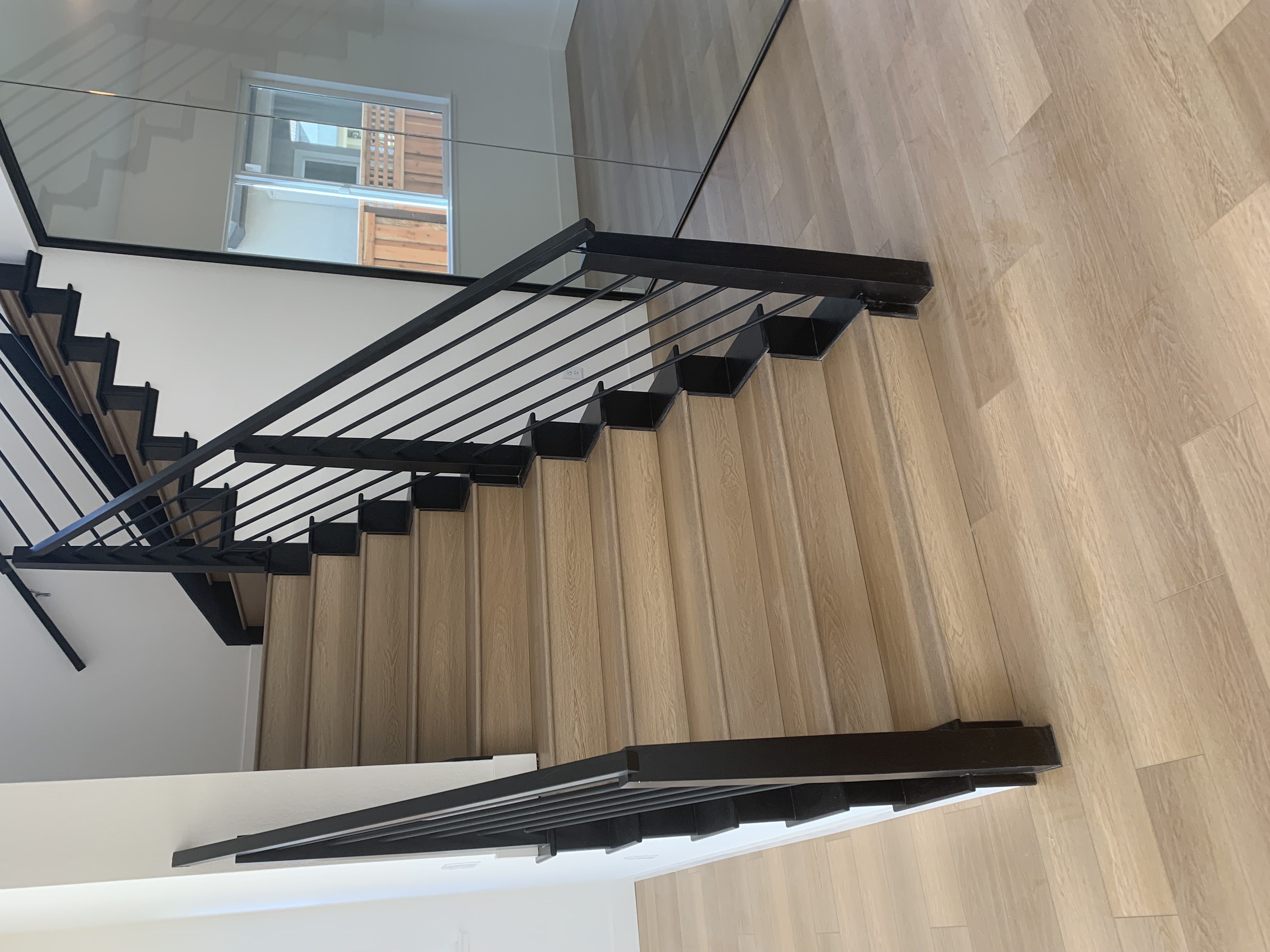 Beautiful room with hardwood flooring installed by Madera Flooring